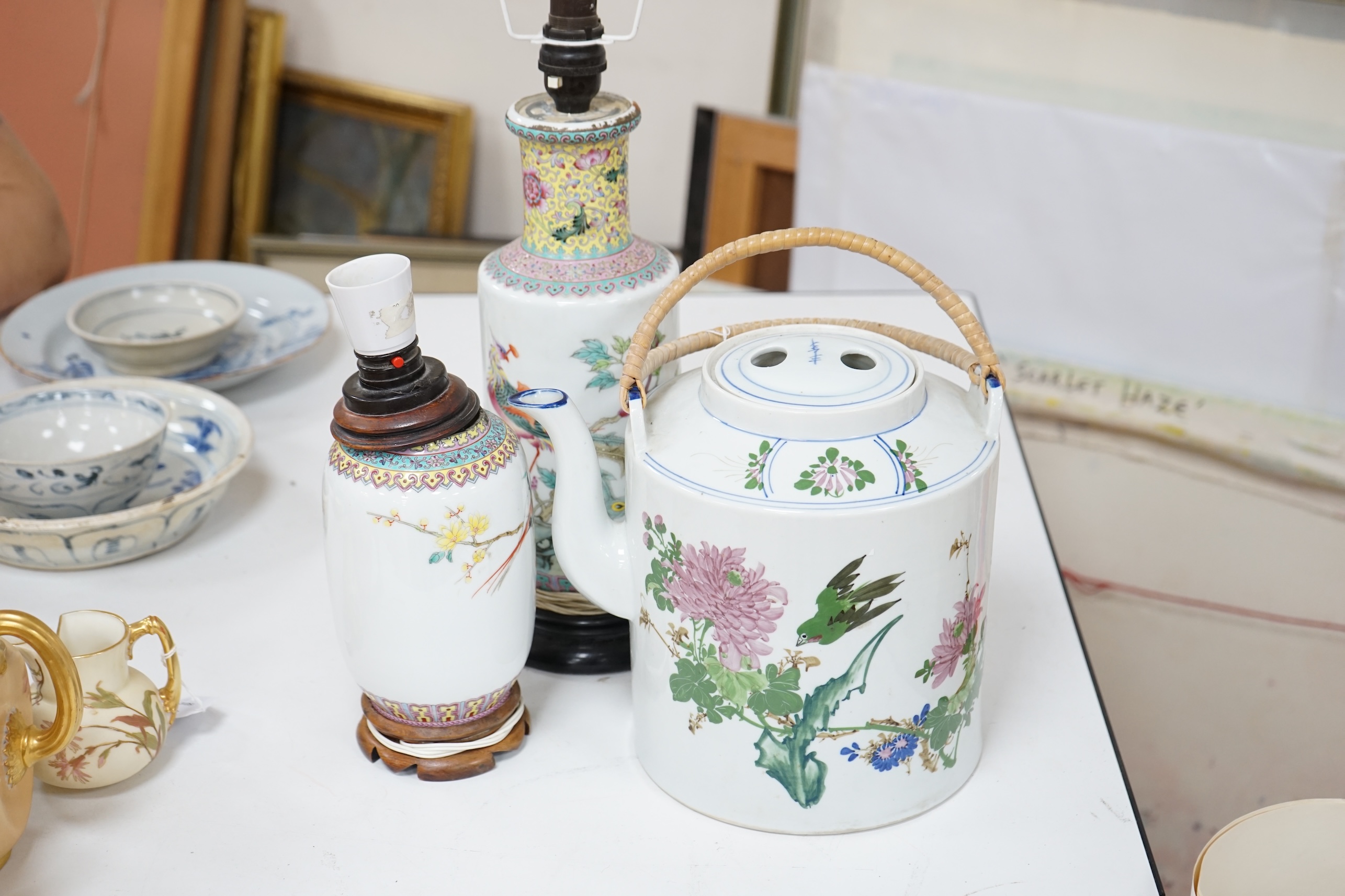 Two early 20th century Chinese famille rose lamps and a large teapot. Condition - fair